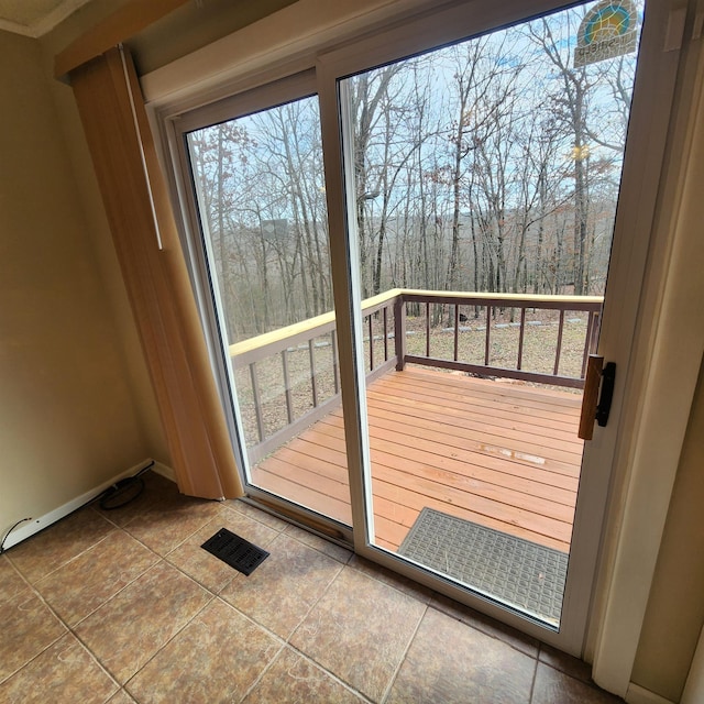 doorway featuring tile patterned flooring