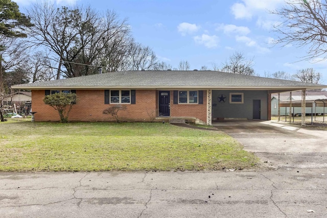 ranch-style home featuring a carport and a front yard