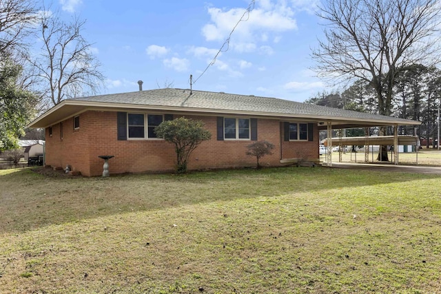 exterior space featuring a yard and a carport