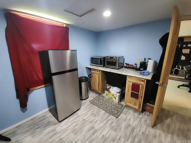 home office featuring light hardwood / wood-style flooring