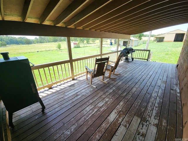 deck with a grill and a yard