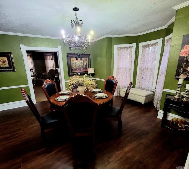 dining space with hardwood / wood-style flooring, an inviting chandelier, and crown molding