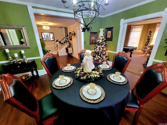 dining area with hardwood / wood-style flooring, a notable chandelier, crown molding, and pool table