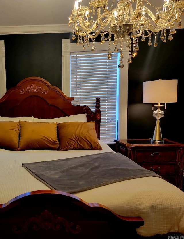 bedroom featuring crown molding and a notable chandelier