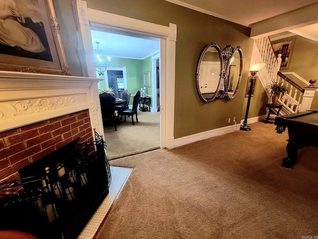 hallway featuring carpet flooring, crown molding, and a chandelier