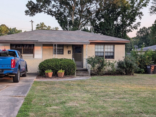 ranch-style house with a front lawn