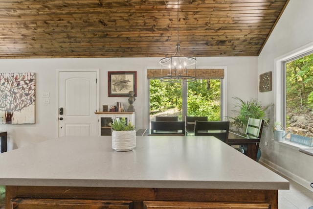 dining area with a chandelier, plenty of natural light, wood ceiling, and lofted ceiling