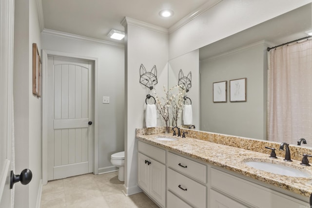 bathroom with tile patterned flooring, toilet, vanity, and ornamental molding