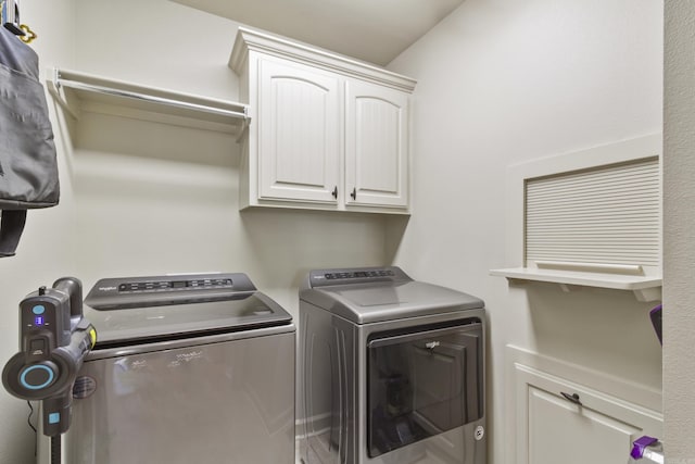 laundry area with cabinets and independent washer and dryer