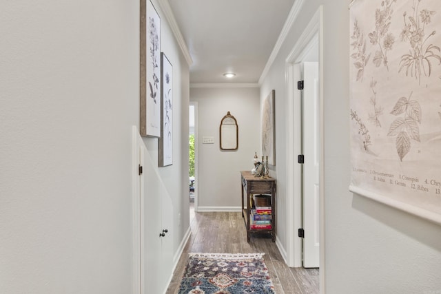 corridor featuring hardwood / wood-style floors and ornamental molding