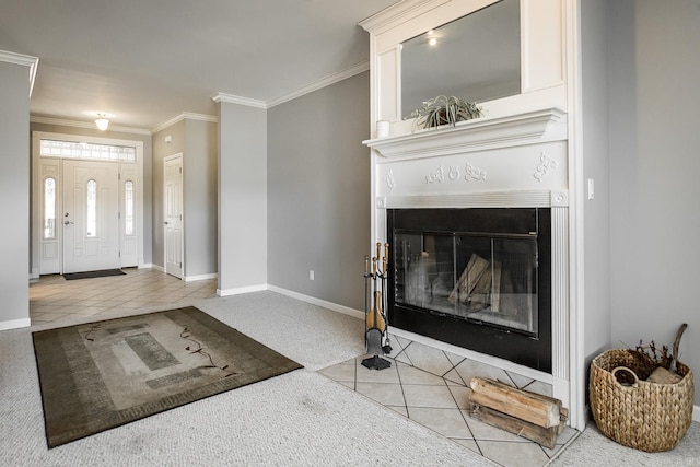 carpeted entryway with a large fireplace and ornamental molding