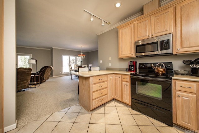 kitchen with electric range, kitchen peninsula, crown molding, track lighting, and light carpet