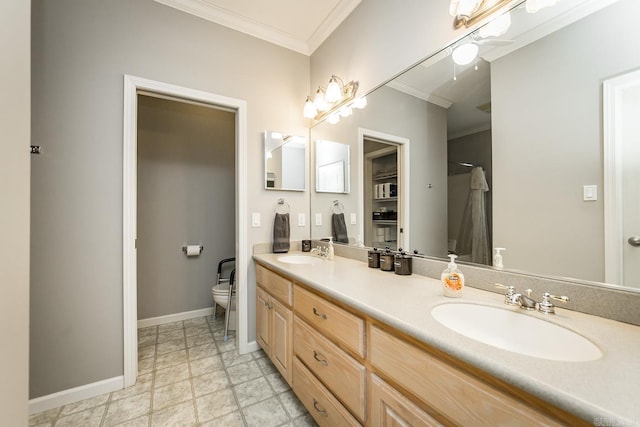 bathroom with ceiling fan, vanity, ornamental molding, and toilet