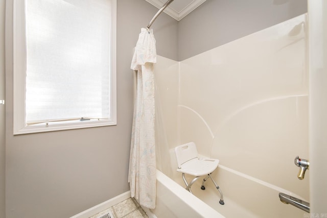 bathroom with tile patterned flooring, shower / bath combination with curtain, and ornamental molding