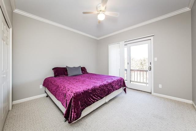 carpeted bedroom featuring access to outside, ceiling fan, a closet, and crown molding