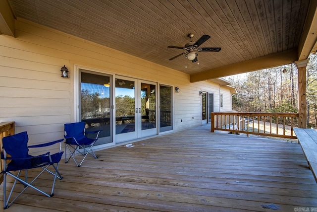 wooden deck with french doors and ceiling fan