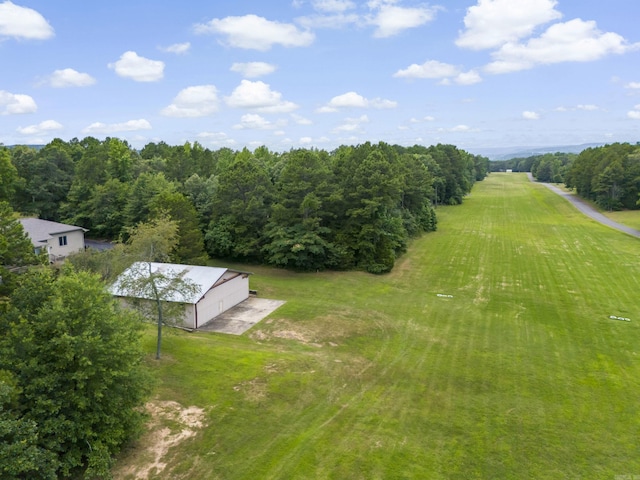 birds eye view of property with a rural view