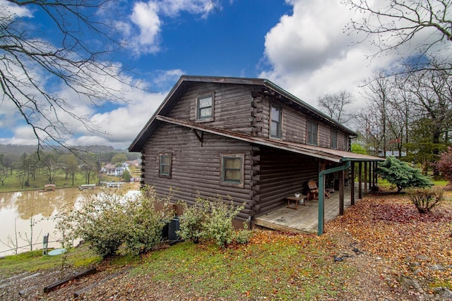 view of side of property with a water view