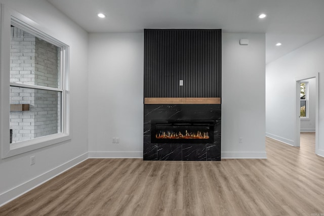 unfurnished living room featuring light hardwood / wood-style floors