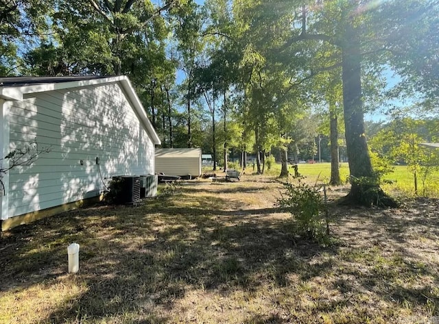 view of yard featuring central AC