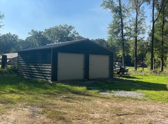 garage featuring a yard