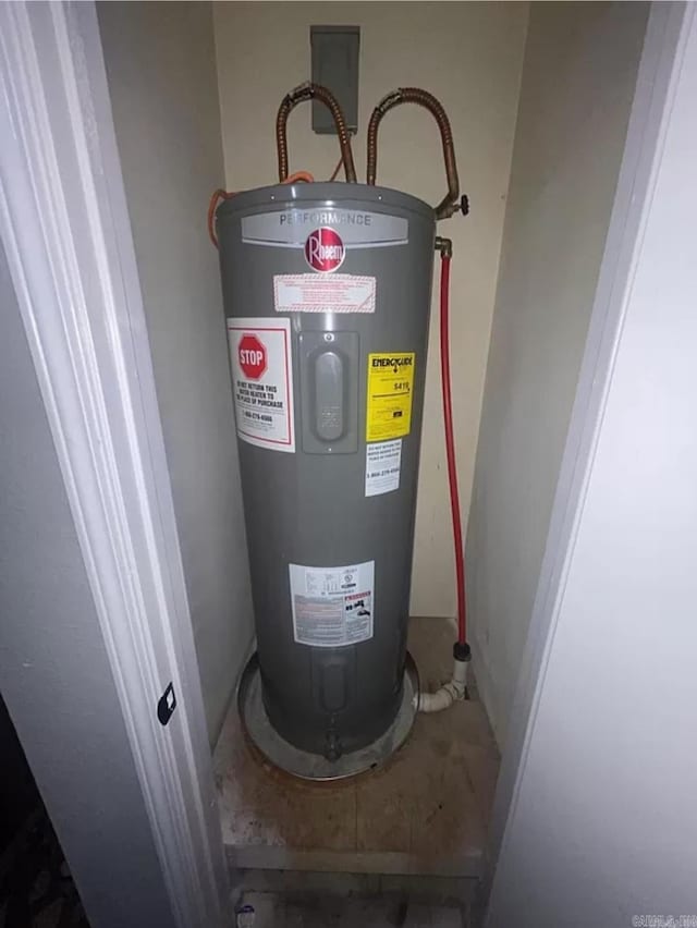 utility room featuring water heater