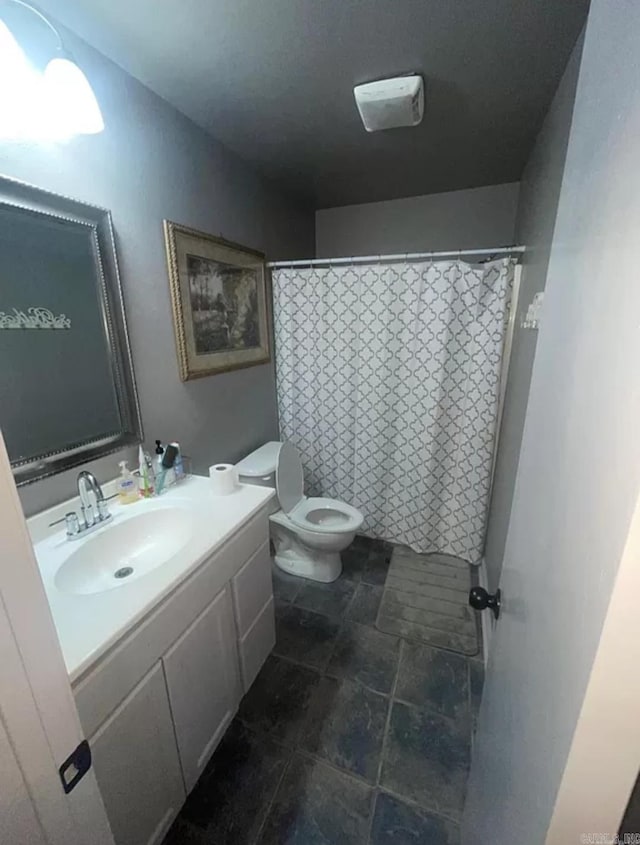 bathroom with vanity and toilet