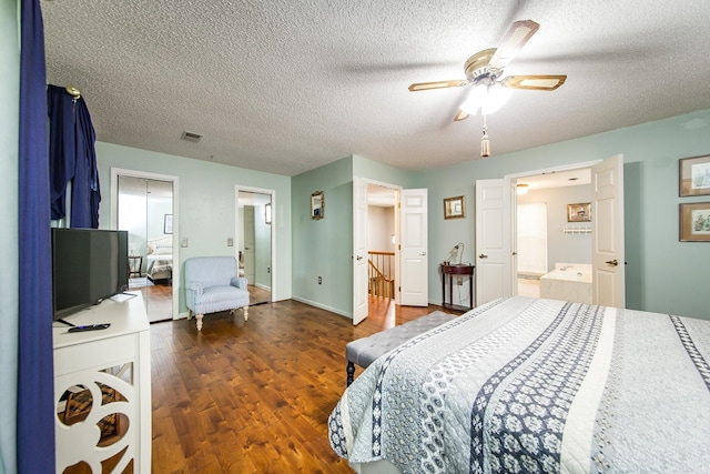 bedroom featuring a textured ceiling, ceiling fan, and dark hardwood / wood-style floors