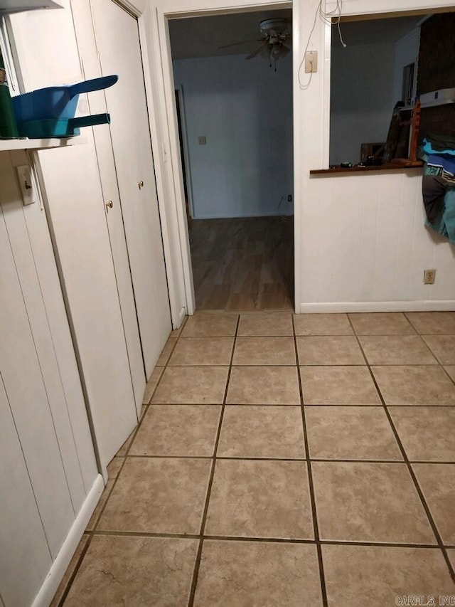 corridor featuring light tile patterned flooring