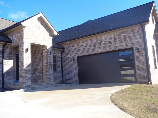 view of side of property with a garage