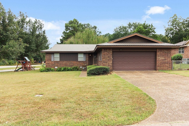 ranch-style house with a garage and a front lawn