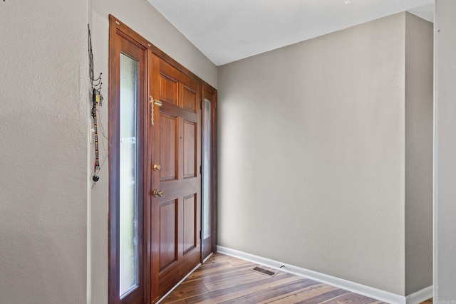 entrance foyer featuring hardwood / wood-style floors