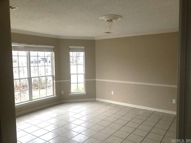 unfurnished room featuring tile patterned flooring, a textured ceiling, and ornamental molding