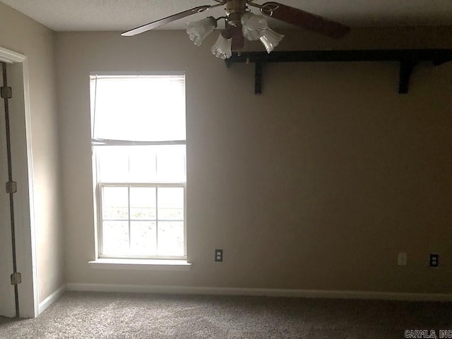 unfurnished room featuring carpet floors and ceiling fan