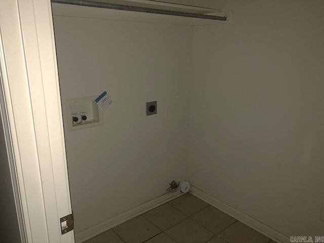 clothes washing area with hookup for a washing machine, tile patterned floors, and electric dryer hookup