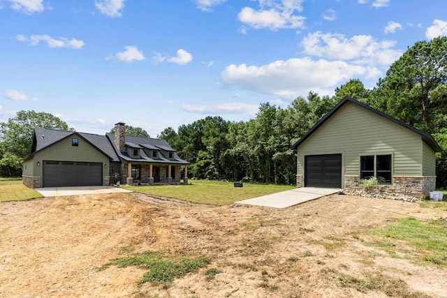 exterior space featuring a garage and a front yard