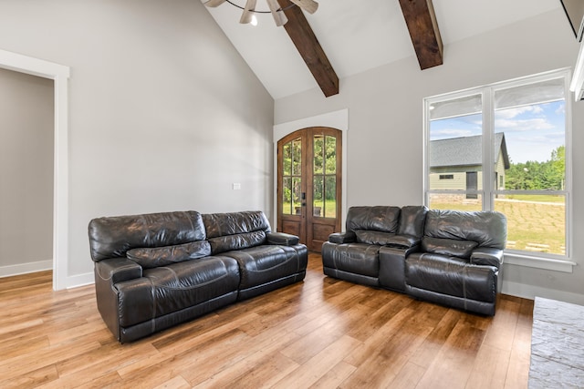 living room with french doors, ceiling fan, high vaulted ceiling, light hardwood / wood-style flooring, and beamed ceiling