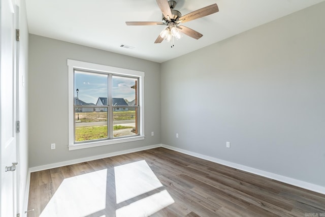 unfurnished room featuring hardwood / wood-style flooring and ceiling fan