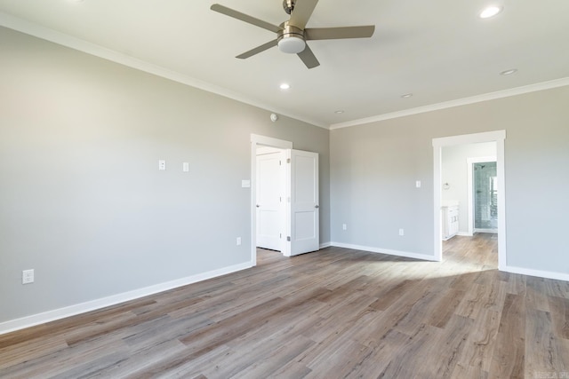 empty room featuring light hardwood / wood-style flooring, ceiling fan, and crown molding