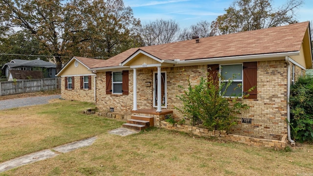 single story home with a front yard