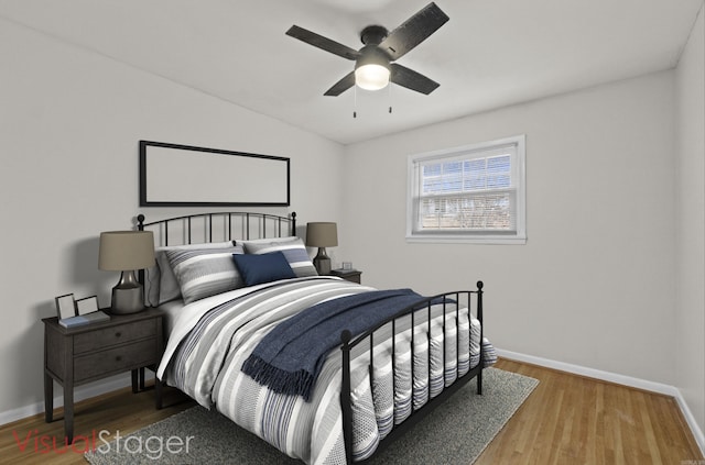 bedroom featuring ceiling fan and hardwood / wood-style floors