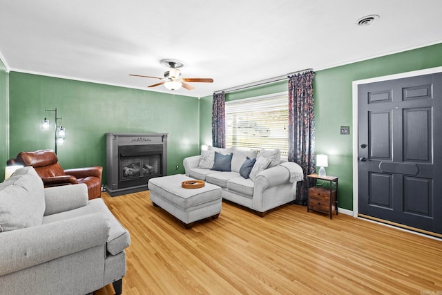 living room with hardwood / wood-style flooring and ceiling fan