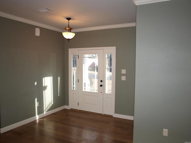 entrance foyer featuring dark hardwood / wood-style flooring and crown molding