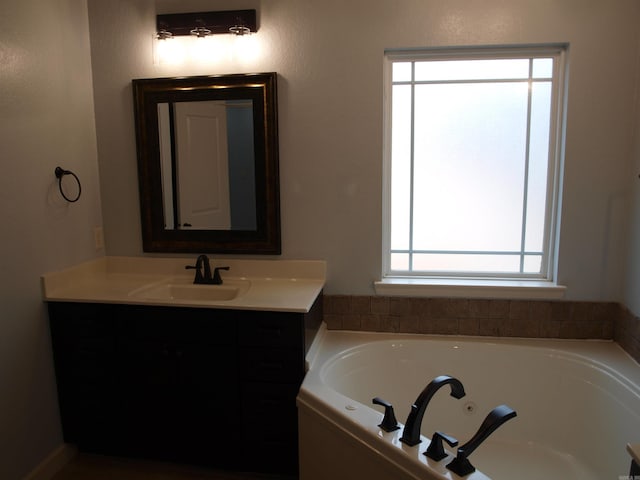 bathroom featuring a tub and vanity