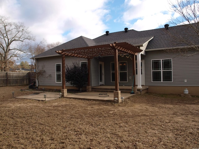 rear view of property with a patio area and a pergola