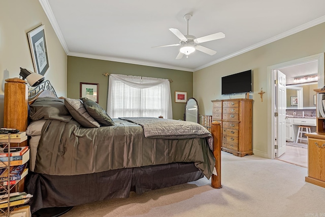 bedroom featuring ensuite bathroom, ceiling fan, light colored carpet, and crown molding