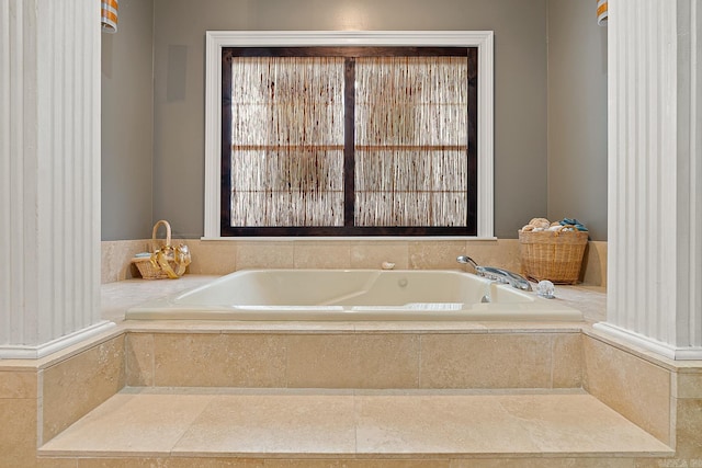 bathroom featuring a relaxing tiled tub