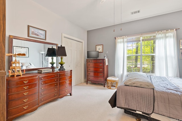 carpeted bedroom featuring a closet