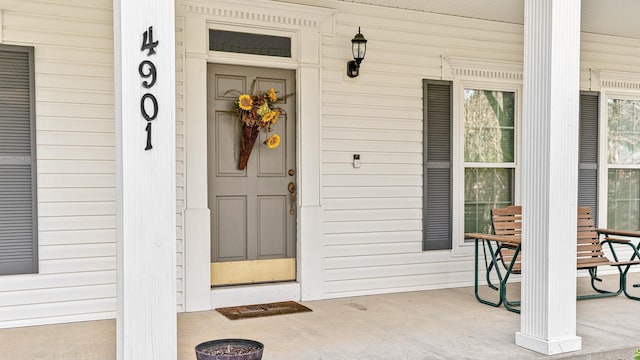 property entrance with covered porch