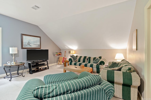 carpeted living room with vaulted ceiling